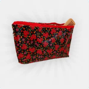 Grande trousse de toilette imperméable noire avec des fleurs